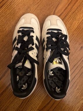 Black and cream adidas sambas